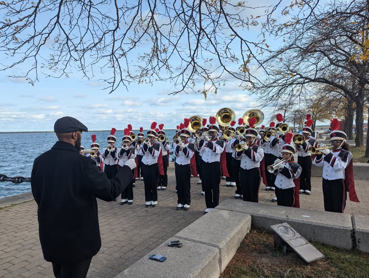 Shaw High School Marching Band performs at Lone Sailor statue unveiling in Voinovich Park in October 2024 under direction of Randy Woods